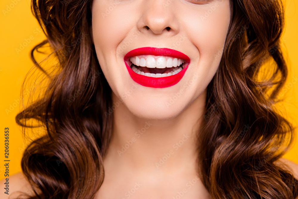 Close up cropped half face portrait of toothy cheerful girl with beaming smile healthy white teeth laughing isolated on yellow background. Tooth care toothcare treatment therapy concept Close up cropped half face portrait of toothy cheerful girl with beaming smile healthy white teeth laughing isolated on yellow background. Tooth care toothcare treatment therapy concept