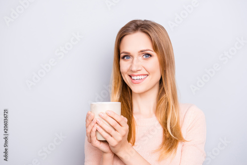 Arabica cappuccino good mood people person toothy beaming smile concept. Close up portrait of satisfied cheerful delightful relaxed cute lady enjoying cacao isolated on gray background copy-space