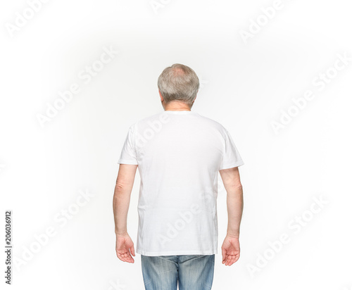 Closeup of senior man's body in empty white t-shirt isolated on white background. Mock up for disign concept