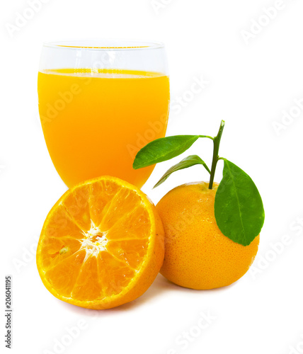 Orange juice in glass and orange fruit slice half