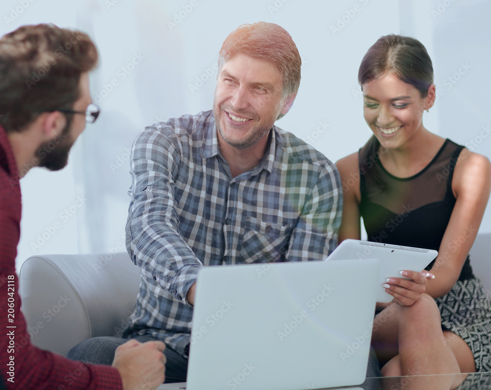 Male executive interacting with his colleague in office Male executive interacting with his colleague in office