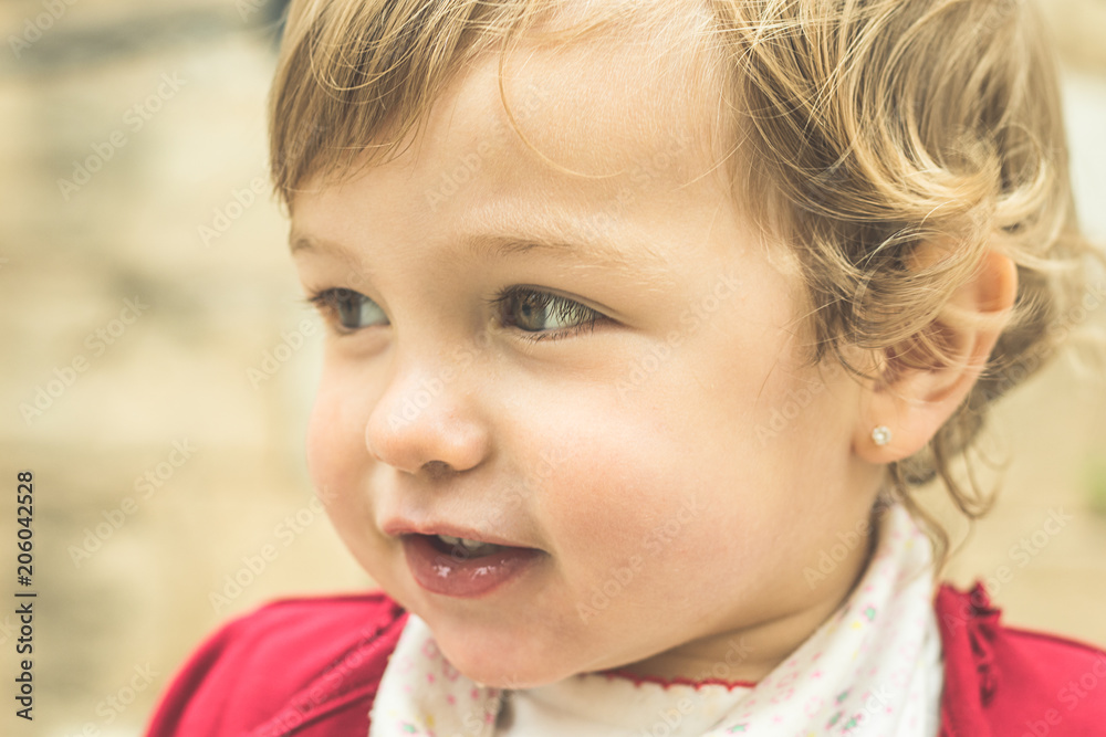 Portrait of a little blonde girl smiling Portrait of a little blonde girl smiling