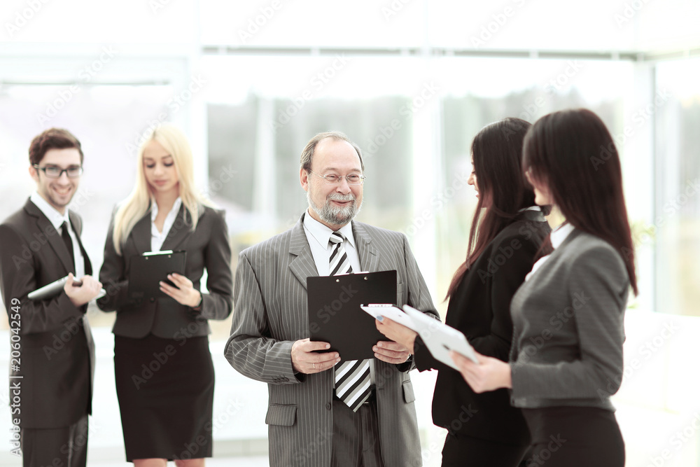 close up.group of business people standing in lobby of office. close up.group of business people standing in lobby of office.
