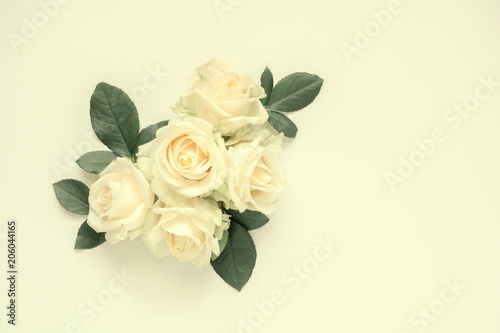 Flowers composition. Pattern made of light rose, gentle soft flowers on pastel yellow background. Flat lay, top view, copy space 
