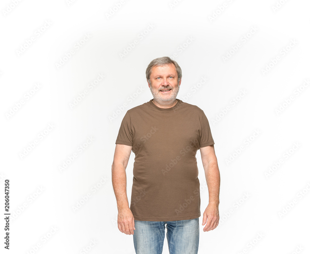 Closeup of senior man's body in empty brown t-shirt isolated on white background. Mock up for disign concept Closeup of senior man's body in empty brown t-shirt isolated on white background. Mock up for disign concept