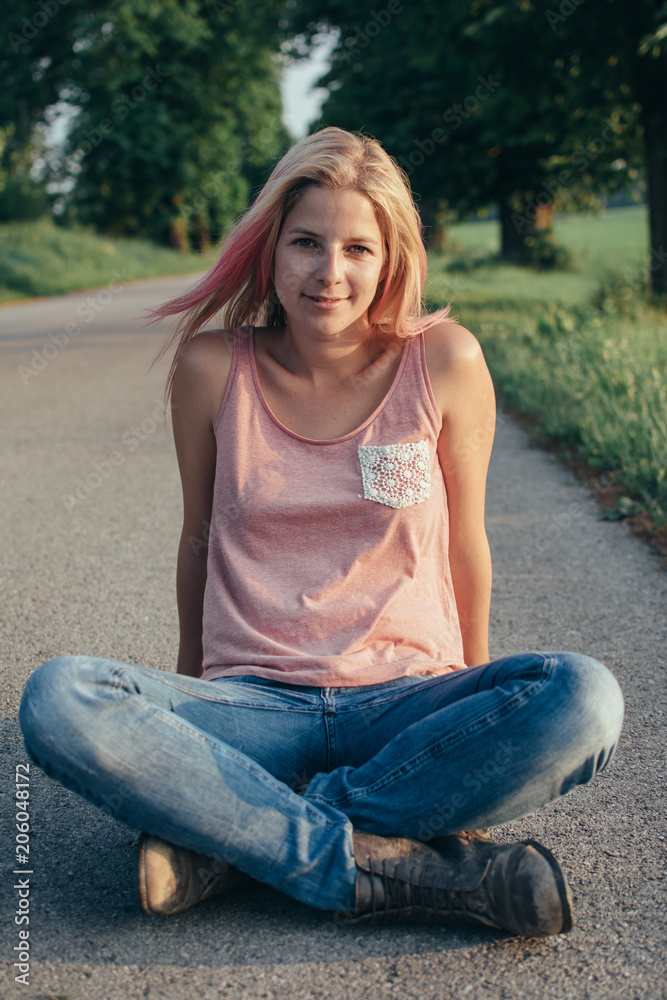 Happy woman waiting on road Happy woman waiting on road