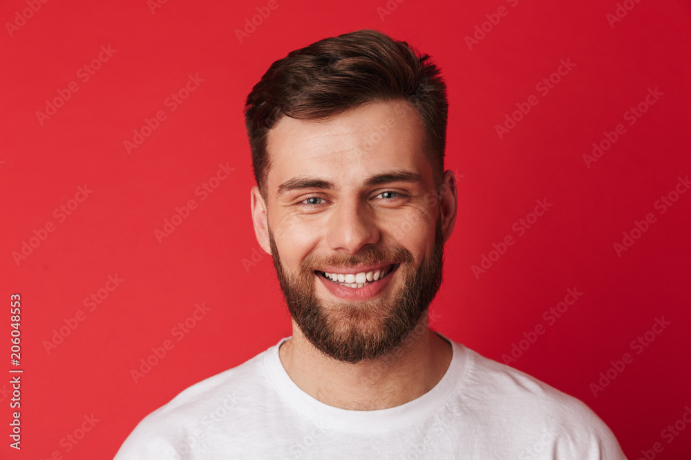 Handsome cheerful young man looking camera. Handsome cheerful young man looking camera.