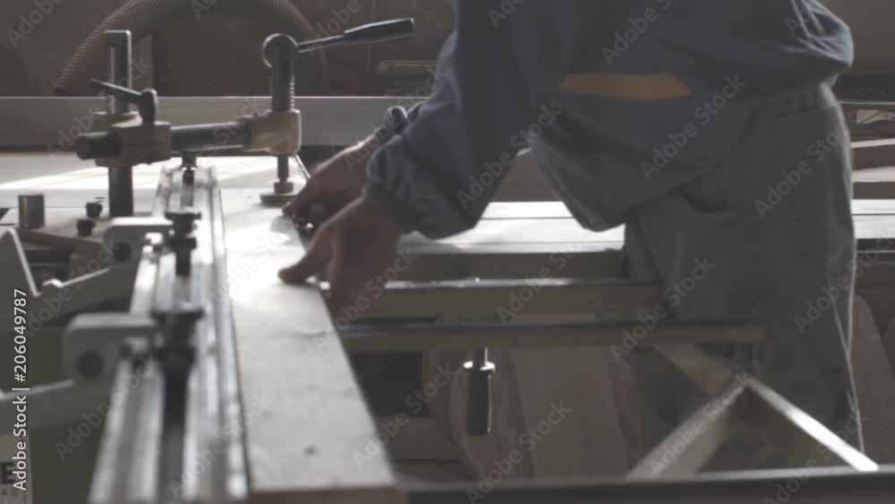 Carpenter preparing wood and taking measures for cutting Carpenter preparing wood and taking measures for cutting