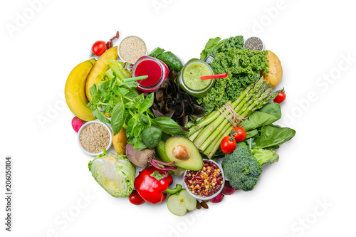 Alkaline diet concept - heart shaped fresh foods on rustic background