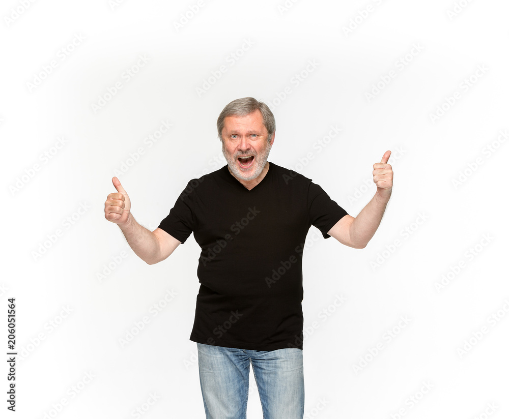 Closeup of senior man's body in empty black t-shirt isolated on white background. Mock up for disign concept Closeup of senior man's body in empty black t-shirt isolated on white background. Mock up for disign concept