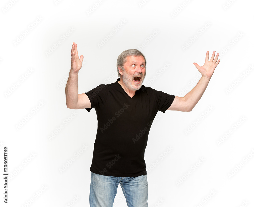 Closeup of senior man's body in empty black t-shirt isolated on white background. Mock up for disign concept Closeup of senior man's body in empty black t-shirt isolated on white background. Mock up for disign concept