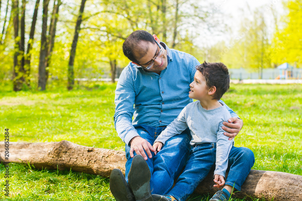 father and son relax in nature father and son relax in nature