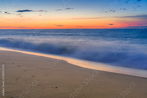 Morning glow of the sunrise over the ocean photo