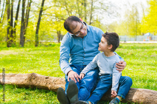 father and son relax in nature © Mariia Nazarova