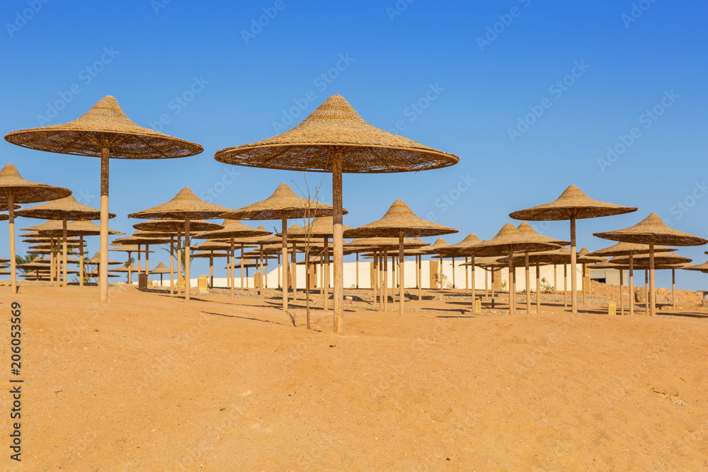Parasols on the beach of Red Sea in Hurghada, Egypt