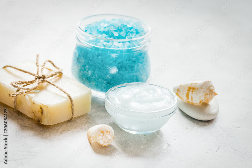 blue spa composition with blue sea salt and natural soap on ston