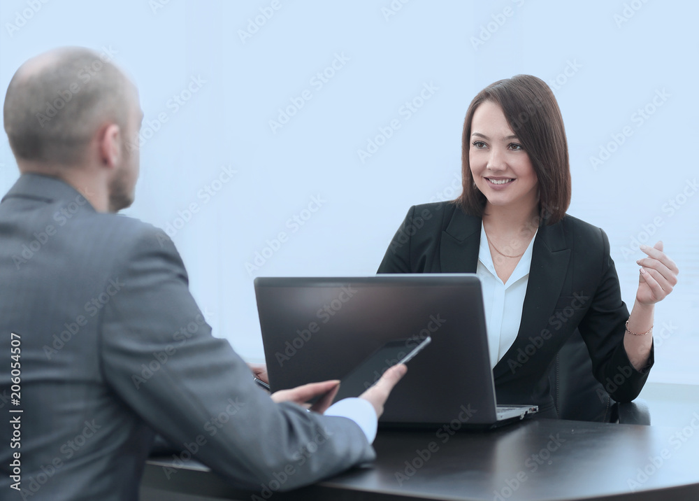 Business people working together at the desk in the office Business people working together at the desk in the office