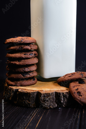 Home made chocolate drops cookies served with organic milk. Dark rustic style