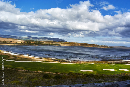 View of Botrivier Lagoon overlooking golf course arabella and mountains south-africa photo