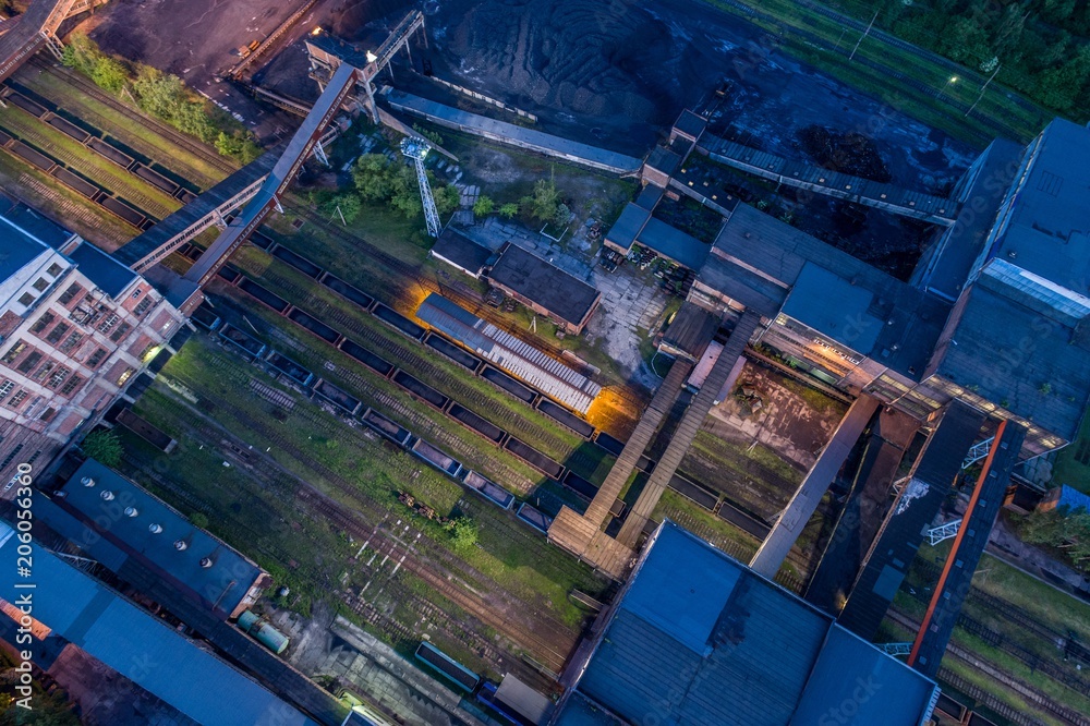 Aerial drone view black coal mine at dusk.