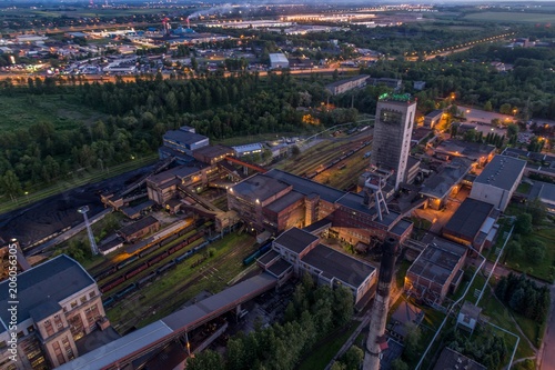 Aerial drone view black coal mine at dusk.