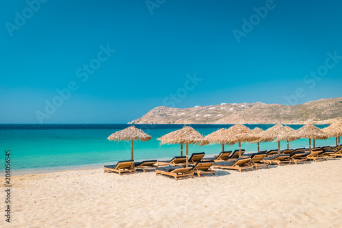 Fototapeta Naklejka Na Ścianę i Meble -  Beach with chars and umbrella of Mykonos Greece