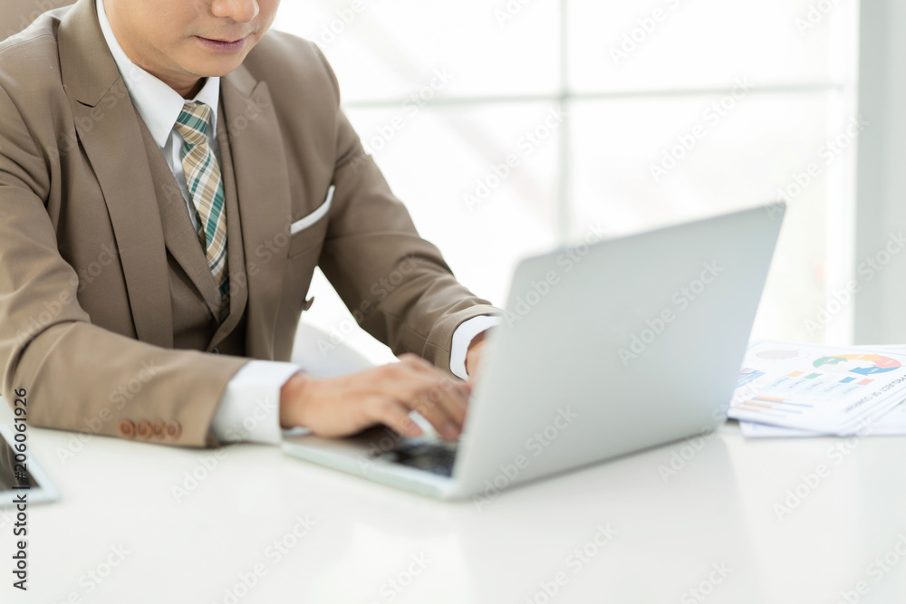 Experienced businessman or lawyer sitting work on laptop computer in the office. Experienced businessman or lawyer sitting work on laptop computer in the office.