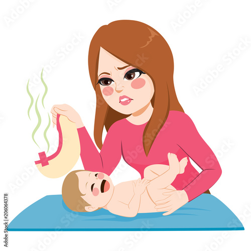 Young mother changing stinky diaper to cute smiling baby