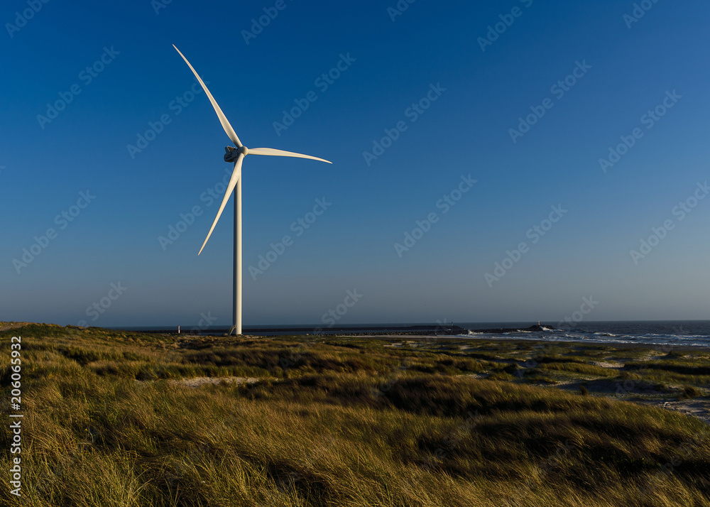 Wind turbine at west coast of North sea, Denmark. Sunset Wind turbine at west coast of North sea, Denmark. Sunset