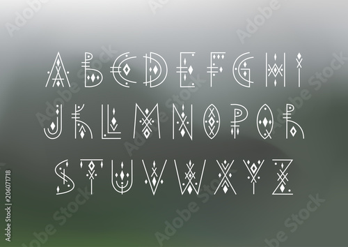Vector alphabet set. Capital letters in geometric indigenous style on a blurred background. For hipster theme, trendy posters.