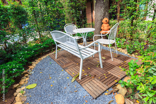 white table and chairs in the gaeden photo