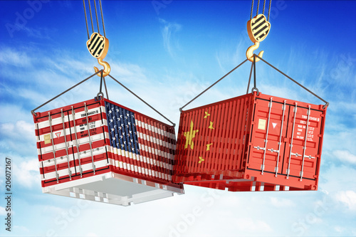 Economic trade war between USA and China, freight transportation concept, cargo containers with USA and China flags hoisted by crane hooks on blue cloudy sky background