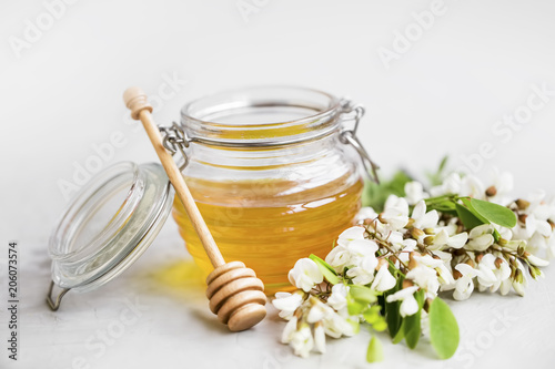 Organic acacia honey jar photo