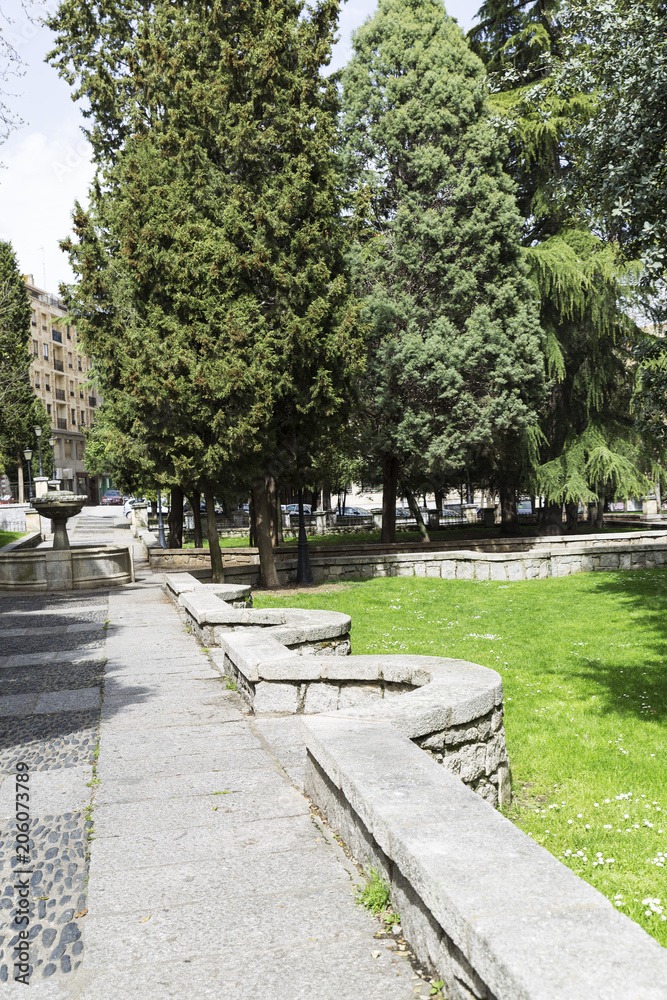 stone path with a beautiful stone fountain in a green park in a city
stone path with a beautiful stone fountain in a green park in a city