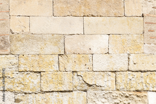 Old stone wall Orange worn by the passage of time, to wallpaper
