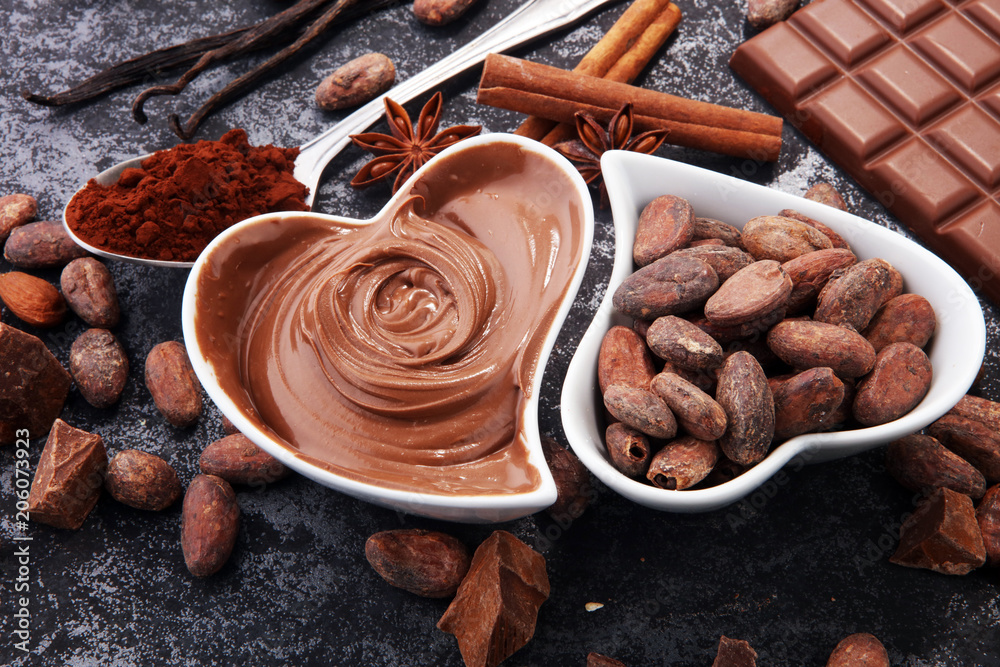 Chocolate bars on table with chocolate powder. Chocolate bars on table with chocolate powder.