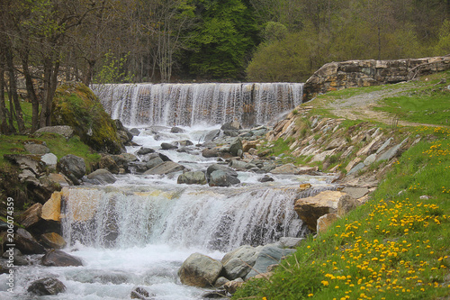 Fototapeta Naklejka Na Ścianę i Meble -  waterfalls in mountains among the meadows