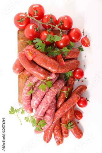 assorted raw sausage on white background