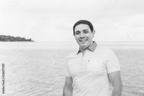 Hispanic man rest at sea, outdoor portrait 