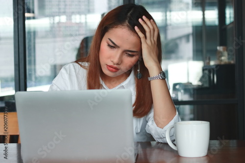 Free Download Front view of anxious upset young Asian business woman suffering from severe from depression in workplace. - GFXLoad