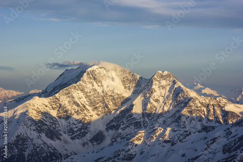 snowy Caucasus mountains at sunset