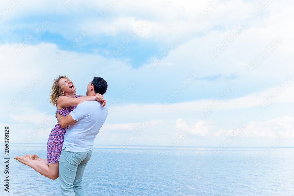 Happy smiling couple, plus size woman at sea outdoors, xl woman on nature, rest and joy the life, man take in hands a lady
 