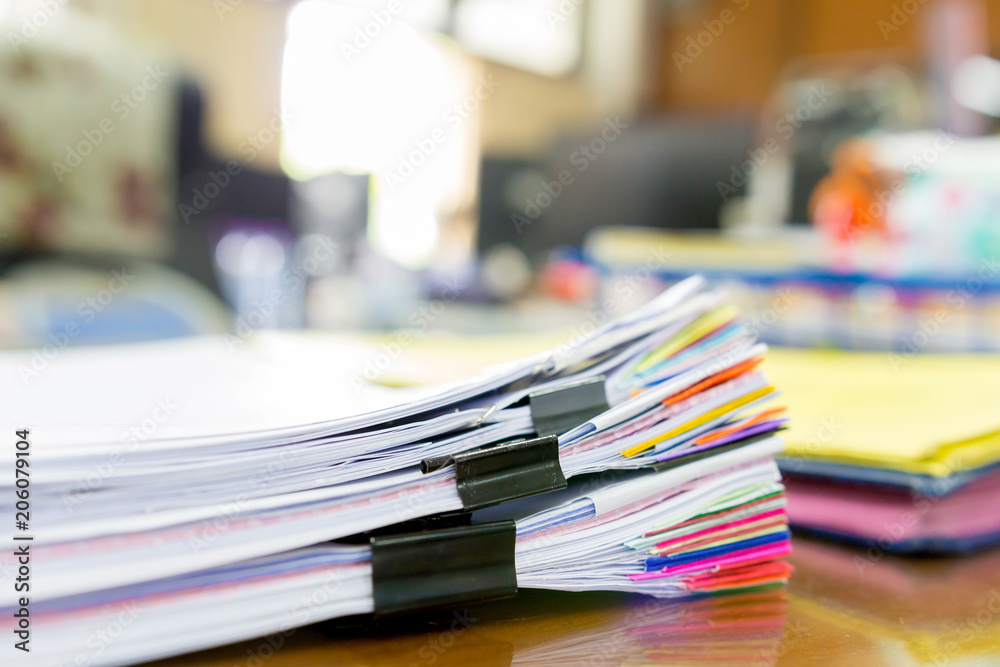 Pile of unfinished a bundle documents on office desk, Stack of business paper Pile of unfinished a bundle documents on office desk, Stack of business paper