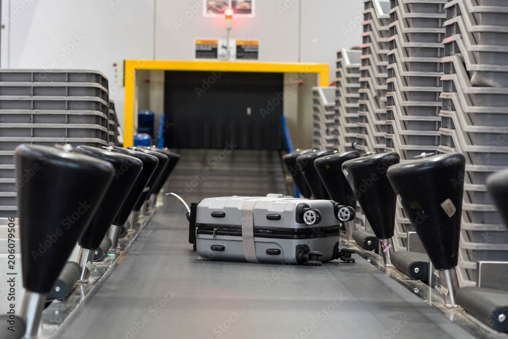 Foto de Suitcase on luggage conveyor belt at baggage handling belt