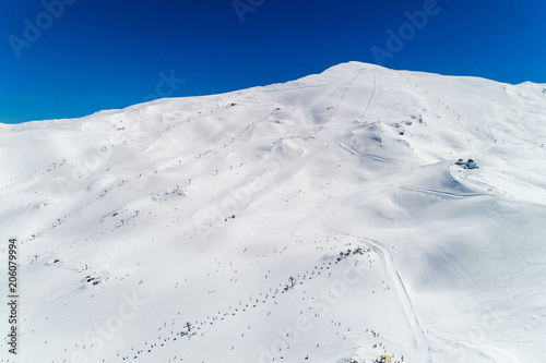 Part of a set of aerial views of the Sierra Nevada mountain resort, at Granada, Spain. Chairlifts, moguls and pistes shown.