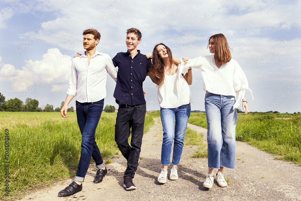 group of young handsome people walk together group of young handsome people walk together