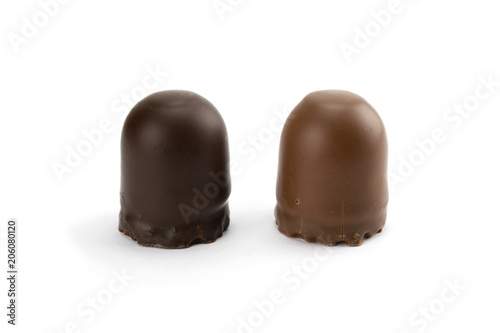 Two chocolate covered marshmallows isolated on white background
