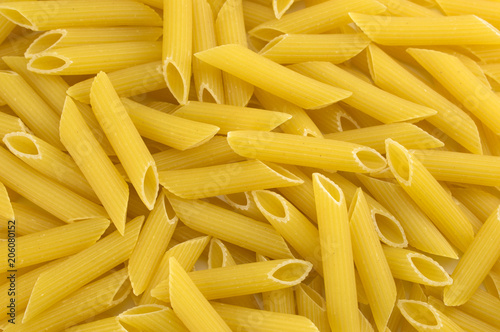 Fresh pasta penne texture background