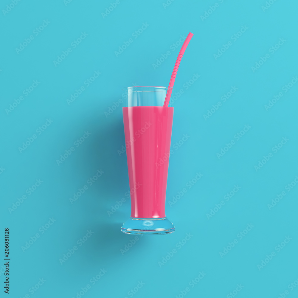 Glass with pink cocktail on bright blue background in pastel colors Glass with pink cocktail on bright blue background in pastel colors