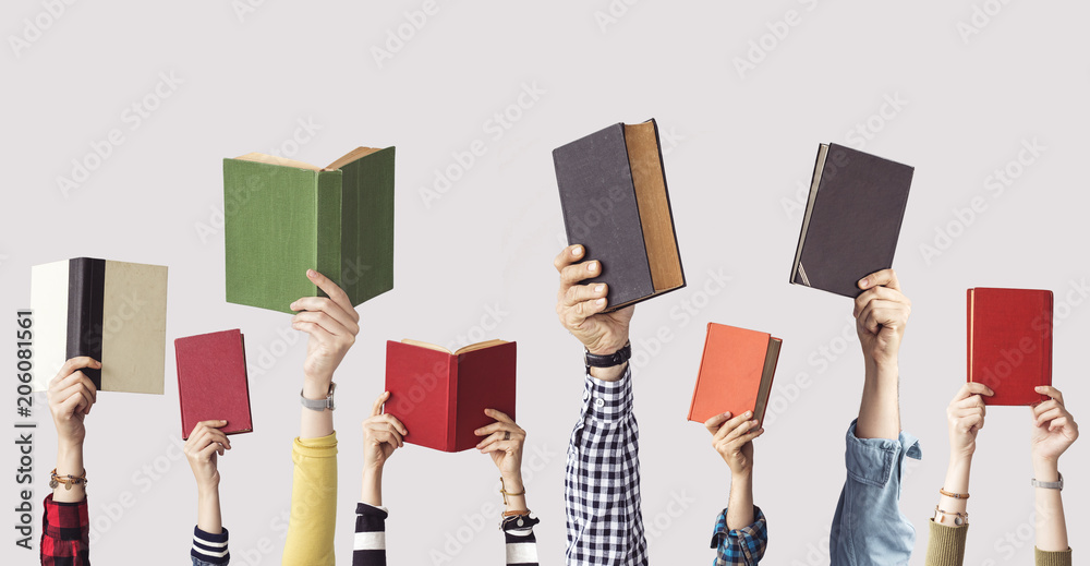 Obraz premium The hands of people hold books